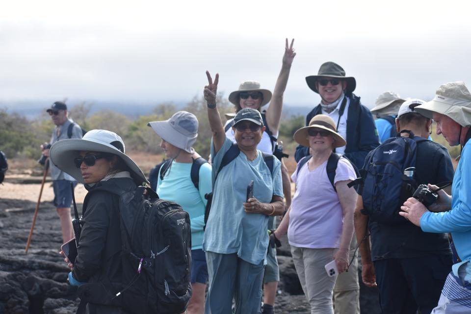 Group of travelers celebrating during a hike