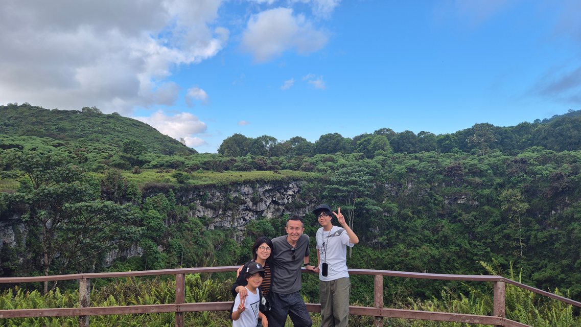 Family at the lookout over one of the Los Gemelos craters