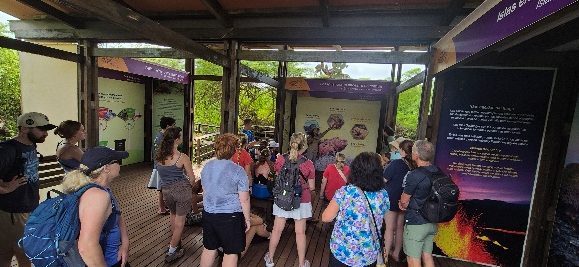Group of travelers with their guide at a visitor center